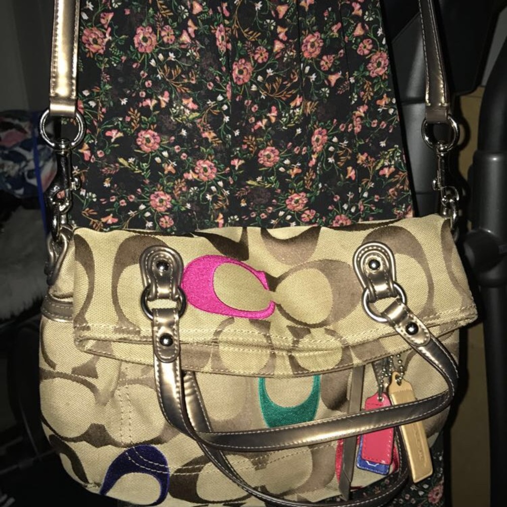 Tan coach purse with colored cs